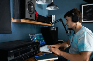 An image of a man working in his soundproof room.