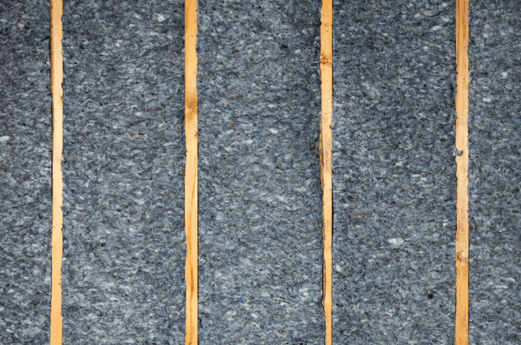 Denim insulation placed between framing boards. 