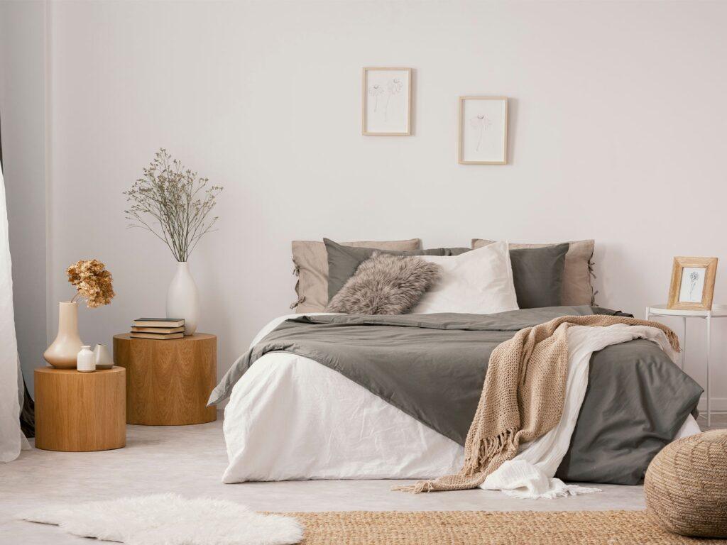 Denim insulation fitted between wooden wall studs.