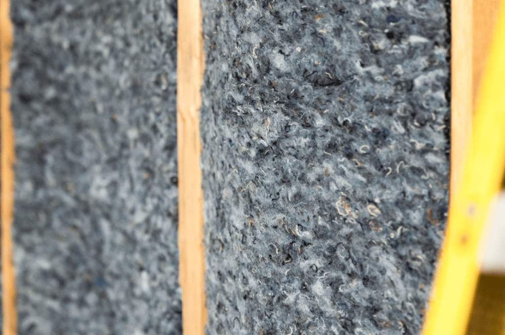 Denim insulation installed between wall studs.