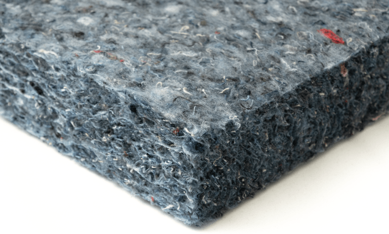 Close-up of recycled denim insulation board used for thermal and acoustic performance. 